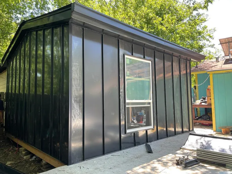 Black standing seam metal wall panels for Roof Inspection in St. Petersburg