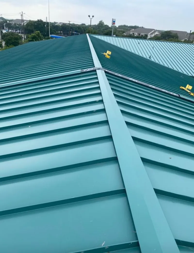 Green commercial metal roof ridge and valley for Metal Roof Repair in St. Petersburg